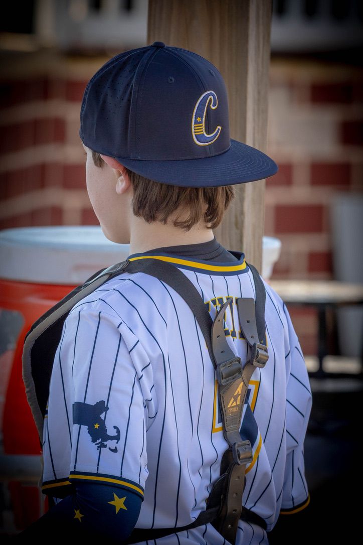 A Captains player from behind, bat on his shoulders